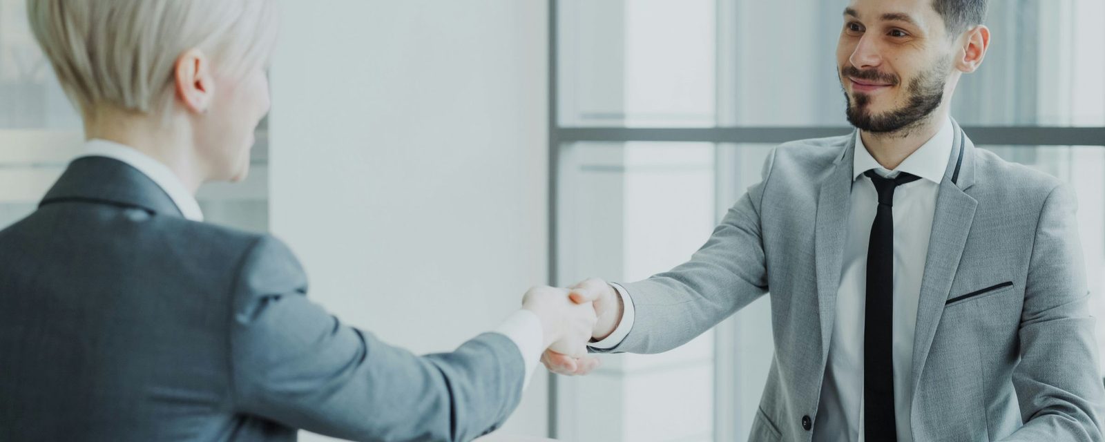 Candidate shaking hands with an interviewer